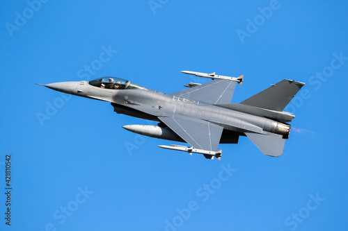 Military air force fighter jet interceptor airplane in full flight.