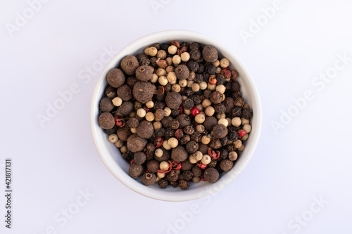 top view five pepper seeds on bowl isolated