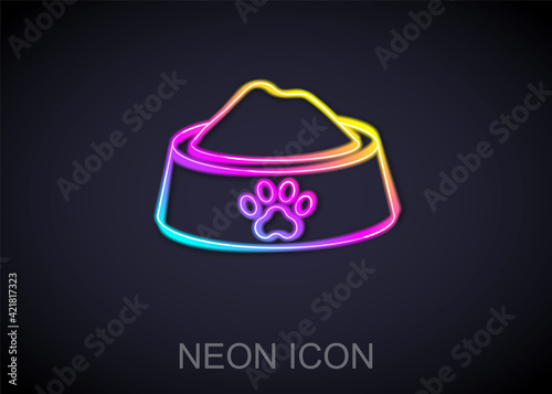 Glowing neon line Pet food bowl for cat or dog icon isolated on black background. Dog or cat paw print. Vector