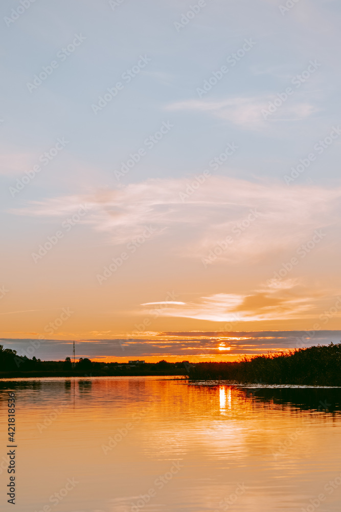 Sunset over the Lielupe river in Latvia during warm summer evening