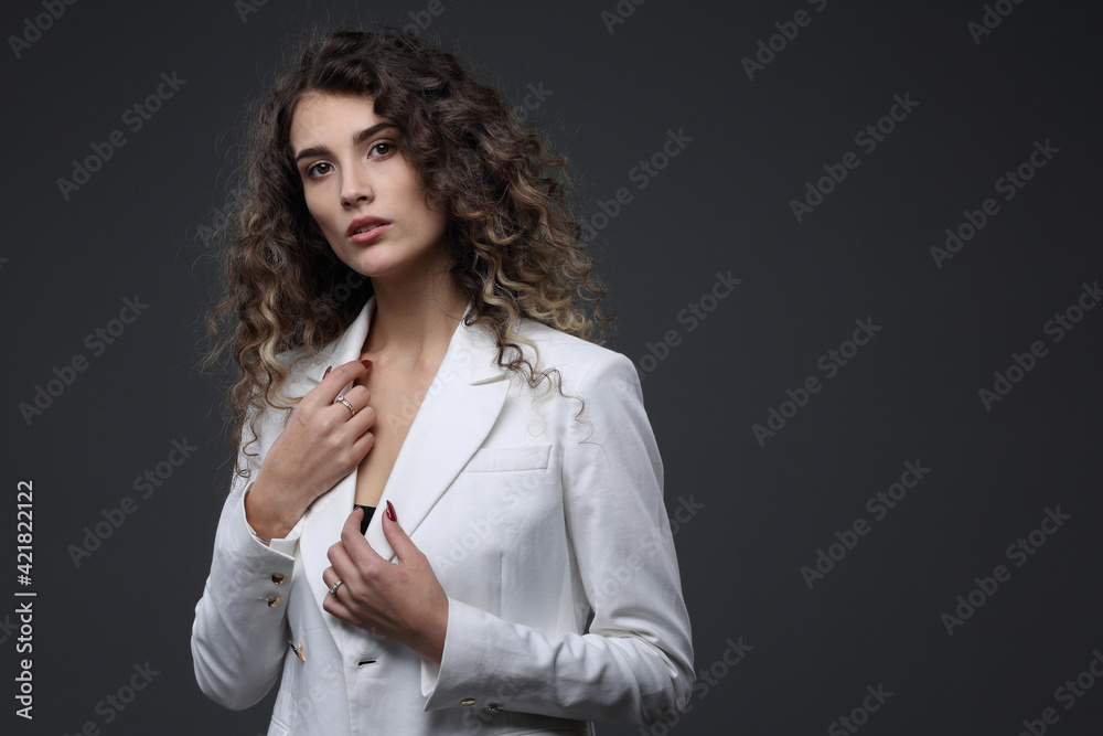 Portrait of a beautiful girl in a white jacket