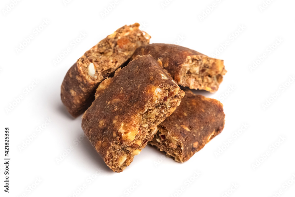 Pieces of energy bars with cranberries on a white background. Muesli or grain bars. Sports nutrition