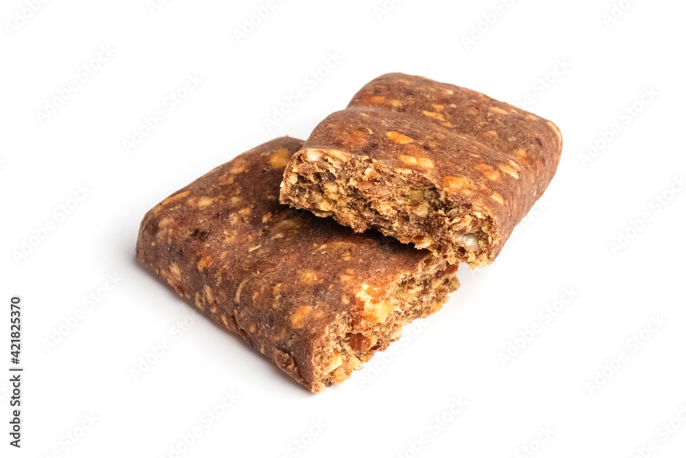 Two pieces of a bar with cranberries on a white background. Muesli or grain bars. Sports nutrition
