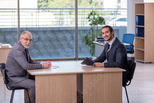 Two businessmen discussing business project