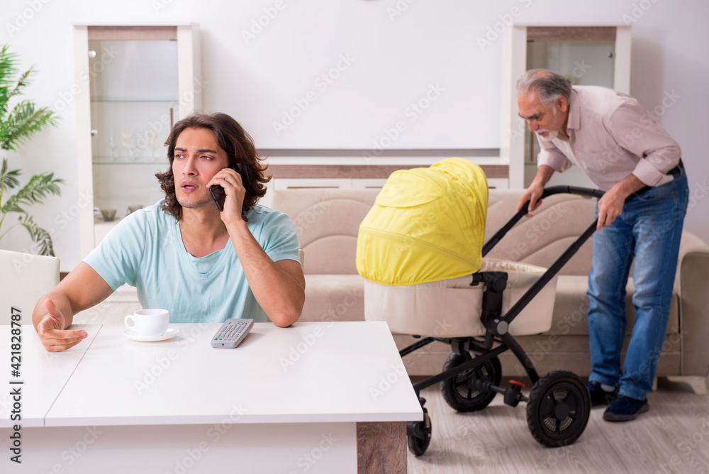 Retired grandfather looking after newborn at home Retired grandfather looking after newborn at home