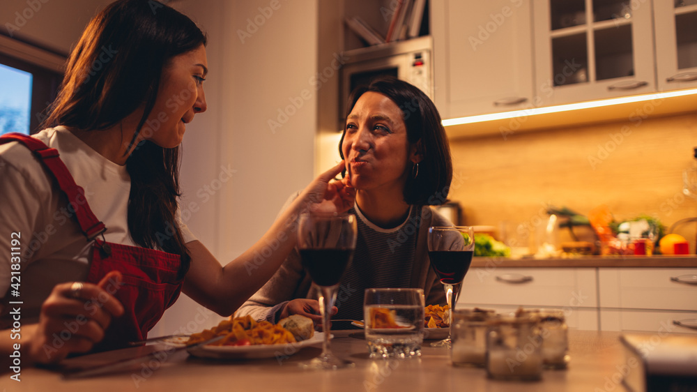 Happy Lesbian Couple in Love Eating Delicious Dinner Meal, Fooling Aroung  and Feeding Each Other. Two Girlfriends Have Lovely Romantic Evening. Young  Partners Talk, Share Beautiful Moments Photos | Adobe Stock
