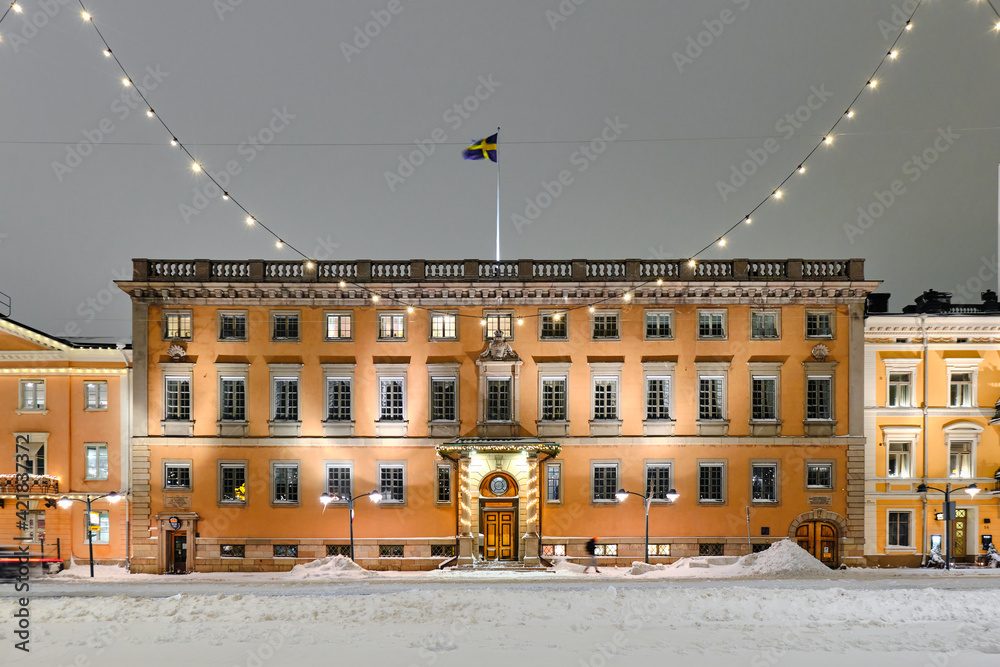 Embassy of Sweden in winter night with Christmas decoration in Helsinki, Finland. The beautiful old classic European architecture.