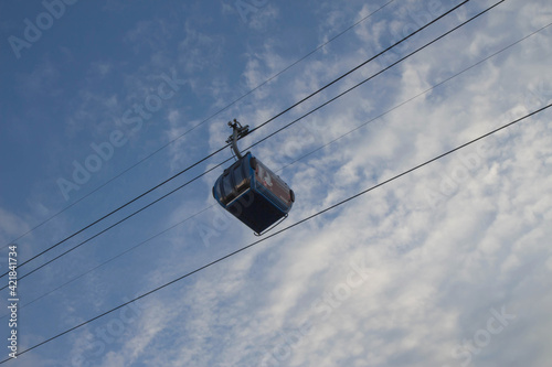 Cable car transporting people. Cable way. Funicular Cable Railway
