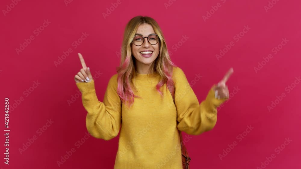 Young blonde woman with backpack intending to realizes the solution while lifting a finger up over isolated background