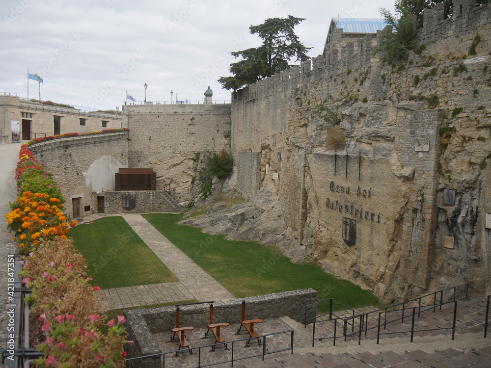San Marino, Cava dei balestrieri. Panorama of the quarry carved into the rock and with a green lawn set up for archery competitions.