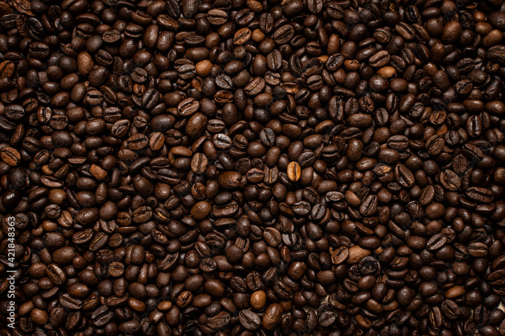 Coffee beans. Coffee beans are spread out on the surface. Coffee beans. Coffee beans are spread out on the surface.