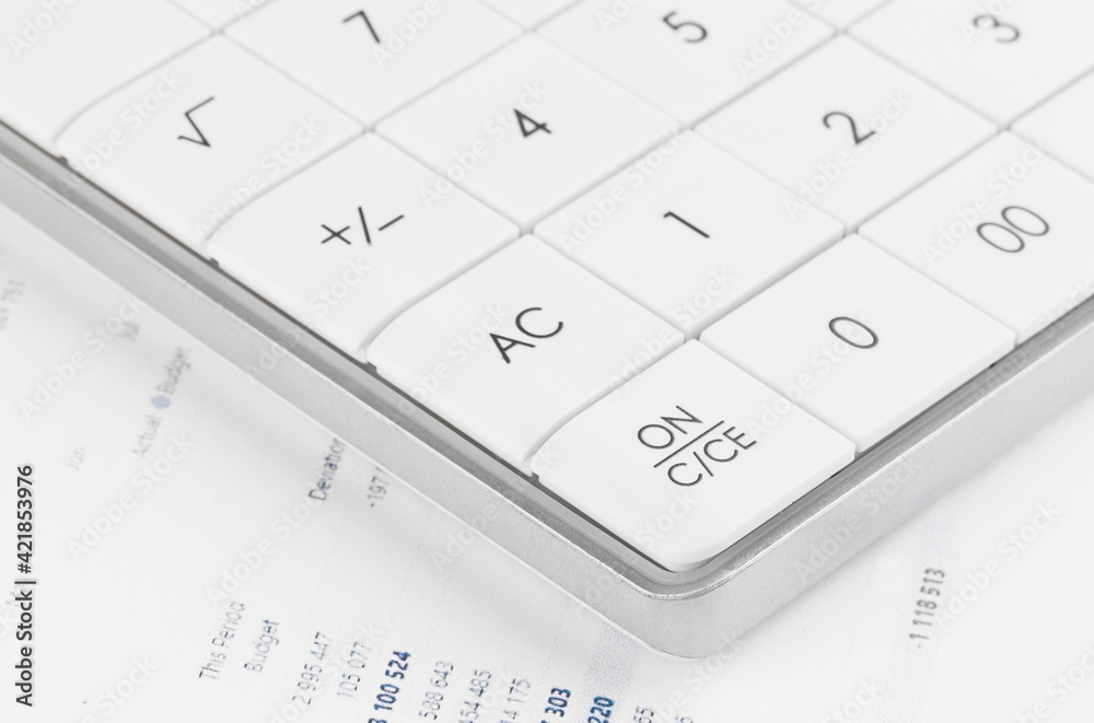 Calculator on financial statement and balance sheeet on desk of auditor. Concept of accounting and audit business. Calculator on financial statement and balance sheeet on desk of auditor. Concept of accounting and audit business.