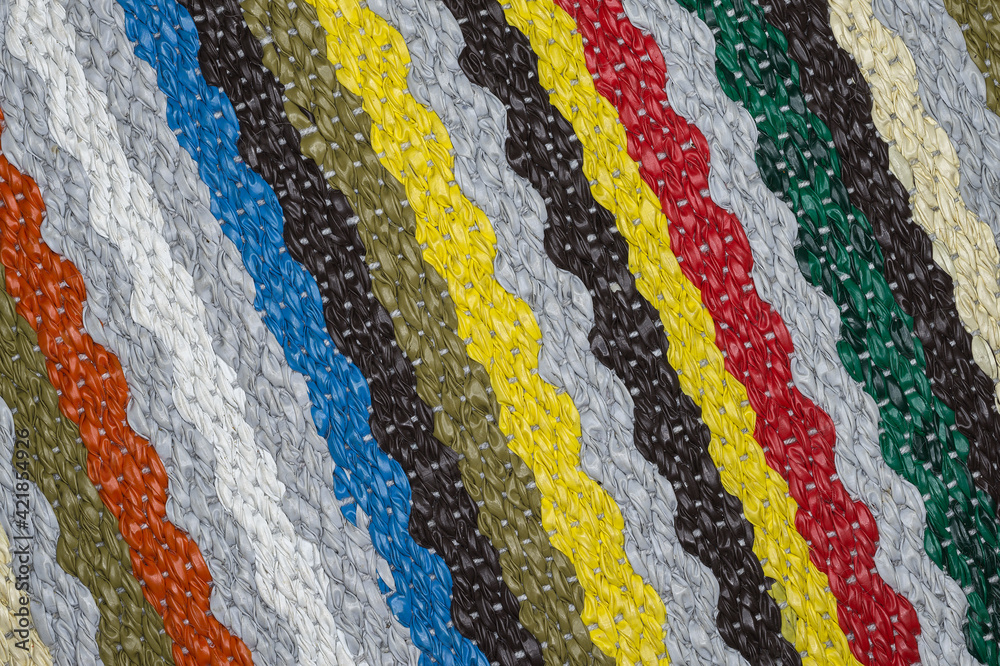 Seamless retro multicoloured carpet with parallel diagonal stripes. The funky textile pattern for the background