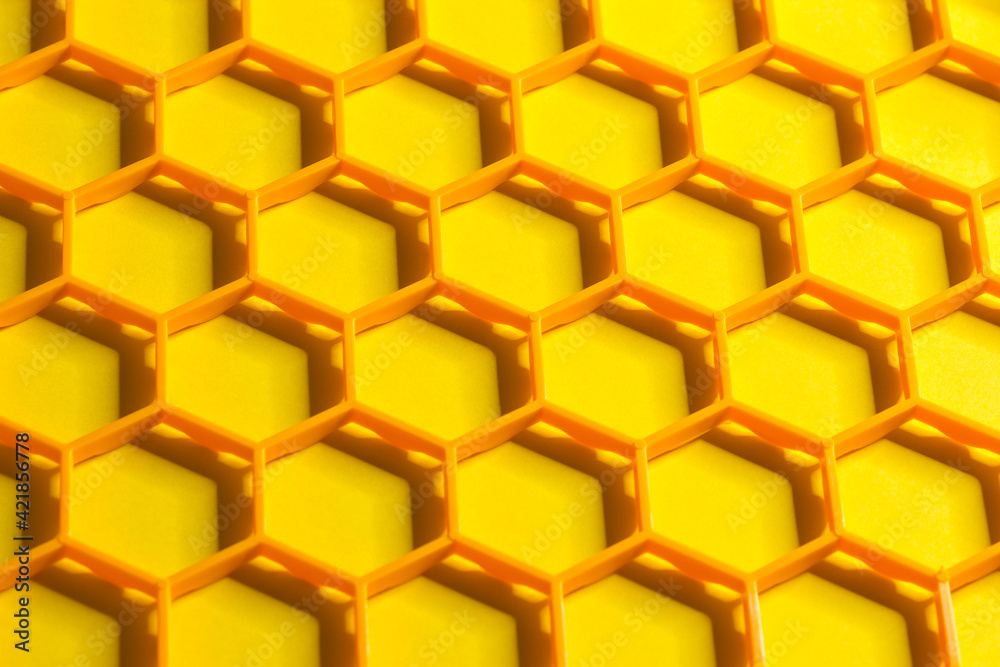 Hexagonal cells grid on a yellow background. Abstract geometric texture. Honeycomb concept Hexagonal cells grid on a yellow background. Abstract geometric texture. Honeycomb concept