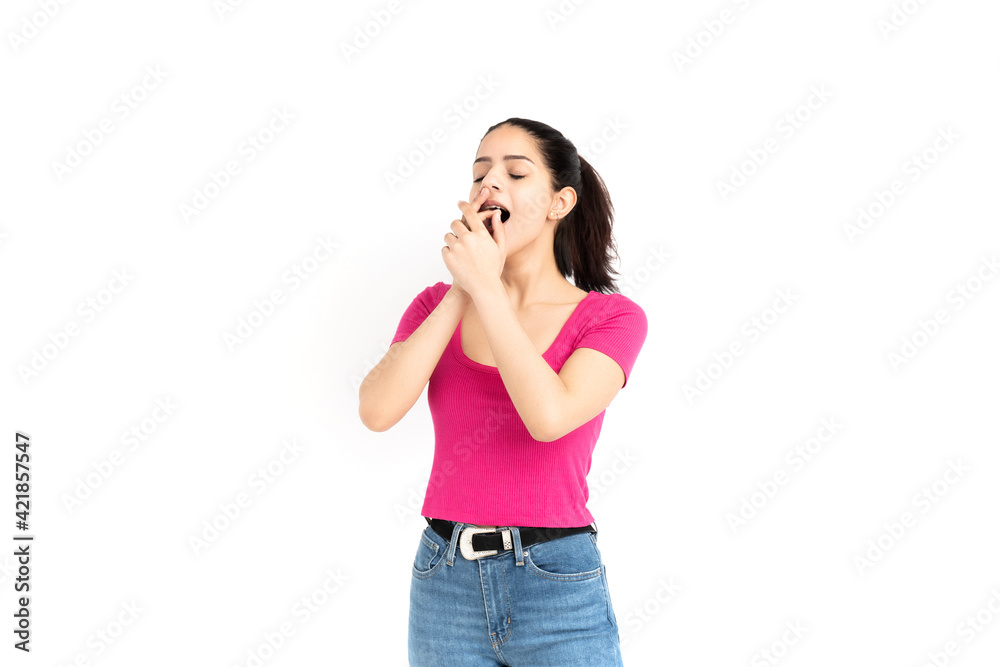 Latin woman yawning on white background Latin woman yawning on white background