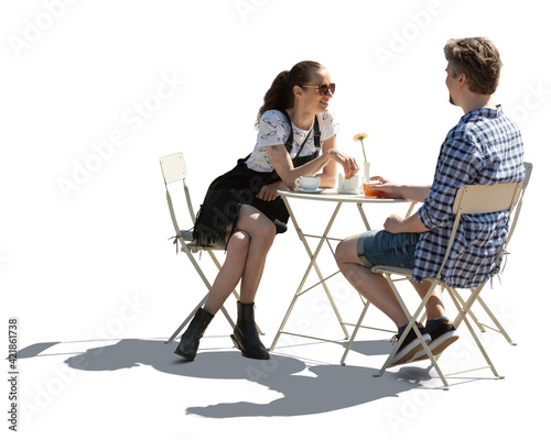 Man and woman sitting in a street cafe and talking, photo is with backlight and people isolated on white background
