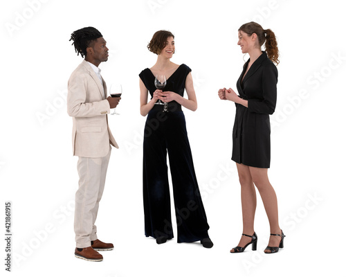 Three young people attending a formal party and they are standing and talking and drinking wine isolated on white background photo