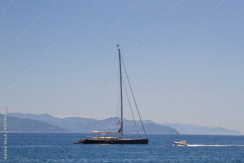 Yachts at sea against the backdrop of the outlines of the mountains. Yachts at sea against the backdrop of the outlines of the mountains.
