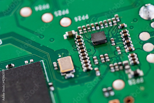 Electronic board for spare parts, macro detail of electronic components for technological equipment © PAOLO