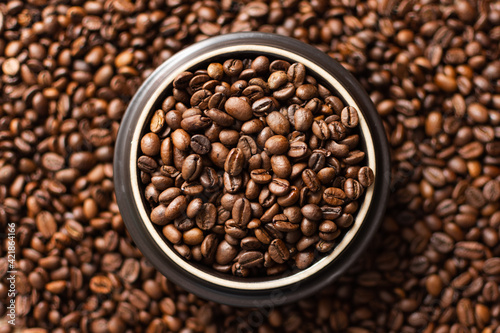 Coffee beans. Coffee beans are spread out on the surface.