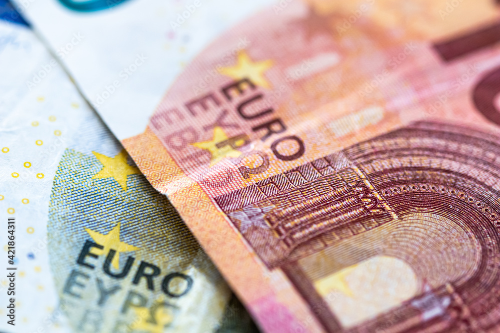 Fototapeta premium Euro money cash, 10 and 5 euro banknotes as a backdrop for topics such as economics, finance, savings and investment.