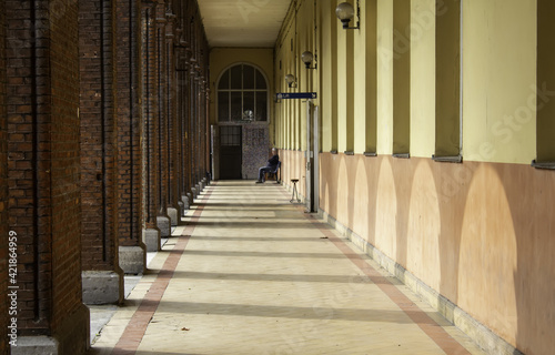 Man sitting in passage