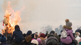 Celebrating the carnival in Russia. The culmination of the holiday is the burning of the effigy. Many people are filming video