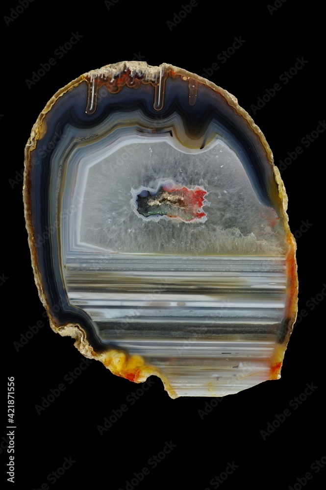 A cross-section of agate. Horizontal agate, filled with quartz. Origin: Rudno near Krakow, Poland. A cross-section of agate. Horizontal agate, filled with quartz. Origin: Rudno near Krakow, Poland.