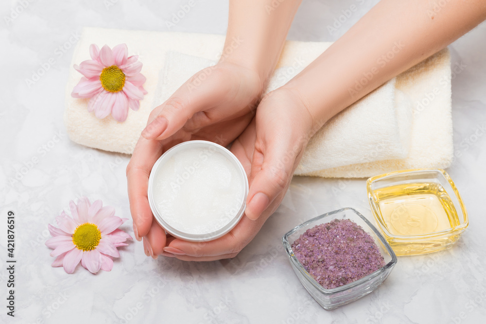 Care for women's hands with baths with sea salt and oil treatment. In the hands of a scrub Care for women's hands with baths with sea salt and oil treatment. In the hands of a scrub