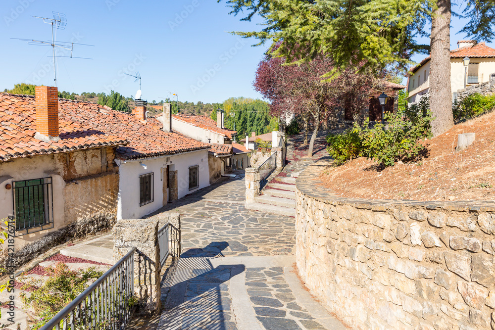 a cobbled street close to the church in Arauzo de Miel, province of Burgos, Castile and Leon, Spain