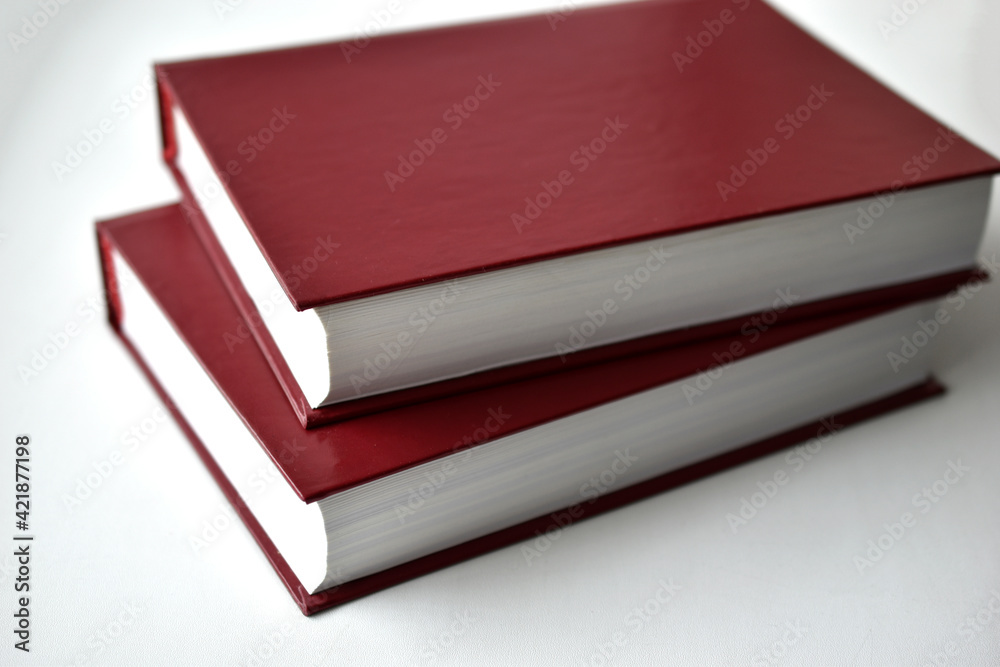 Red bound books on a white background Red bound books on a white background