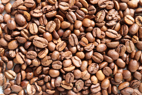 Coffee beans background. Roasted arabica texture. Top view