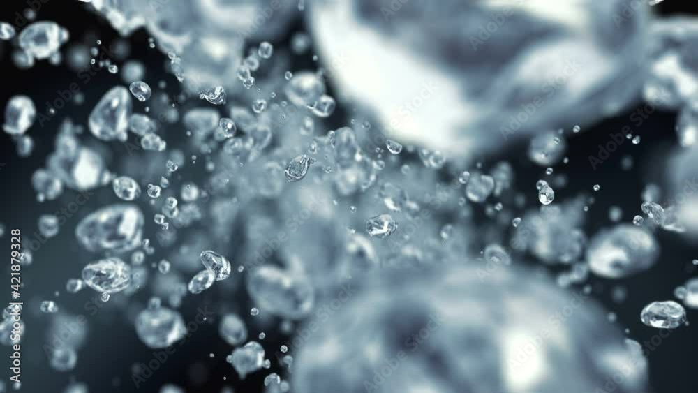 Water drops flying in super slow motion 4K