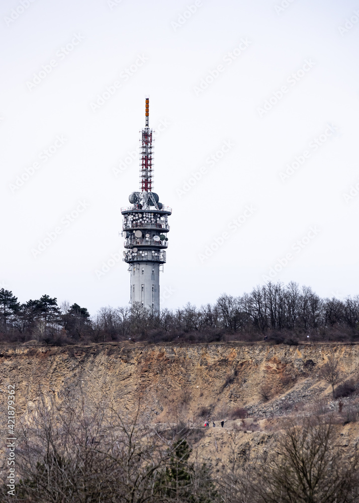 Brno, Czech Republic - March 20, 2021: Transmitter Hady from the road and people sporting beneath.
