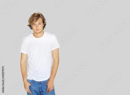 Teenager standing near white wal