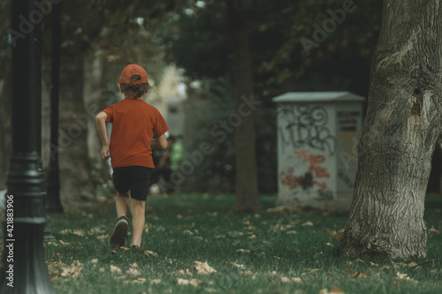 Red Tishirt Bo Running on Park photo