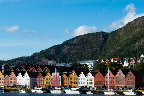 Bryggen street with wooden colored houses in Bergen during sunny summer, Norway