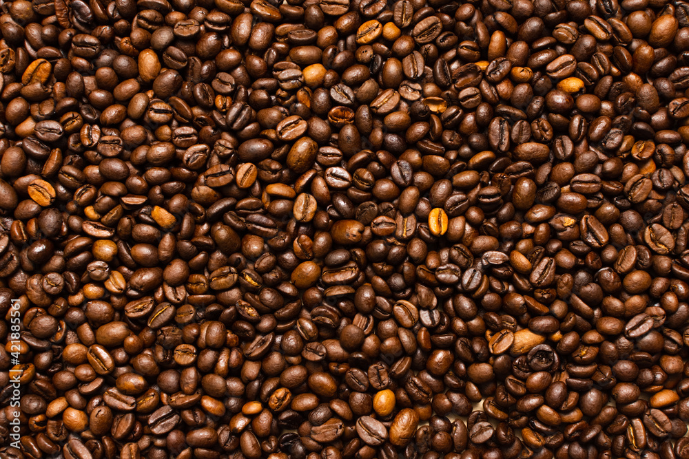 Coffee beans. Coffee beans are spread out on the surface. Coffee beans. Coffee beans are spread out on the surface.