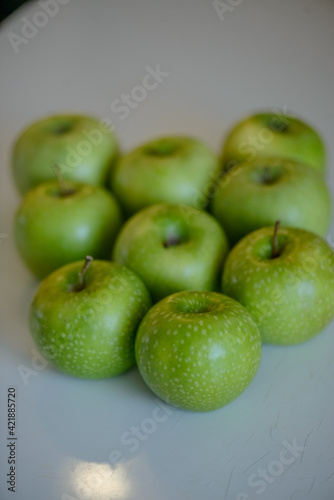 Green apples close up on white background