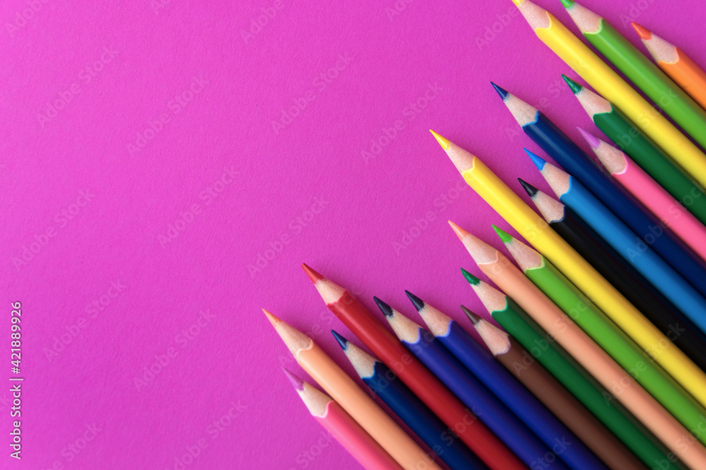 Much colour pencils on the pink background.