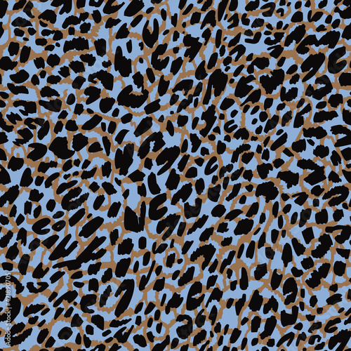 Seamless pattern made of leopard spots skin texture. African animal fur background. Spotted ornament. Vintage style. Good for wrapping, banner, fashion, textile and fabric.