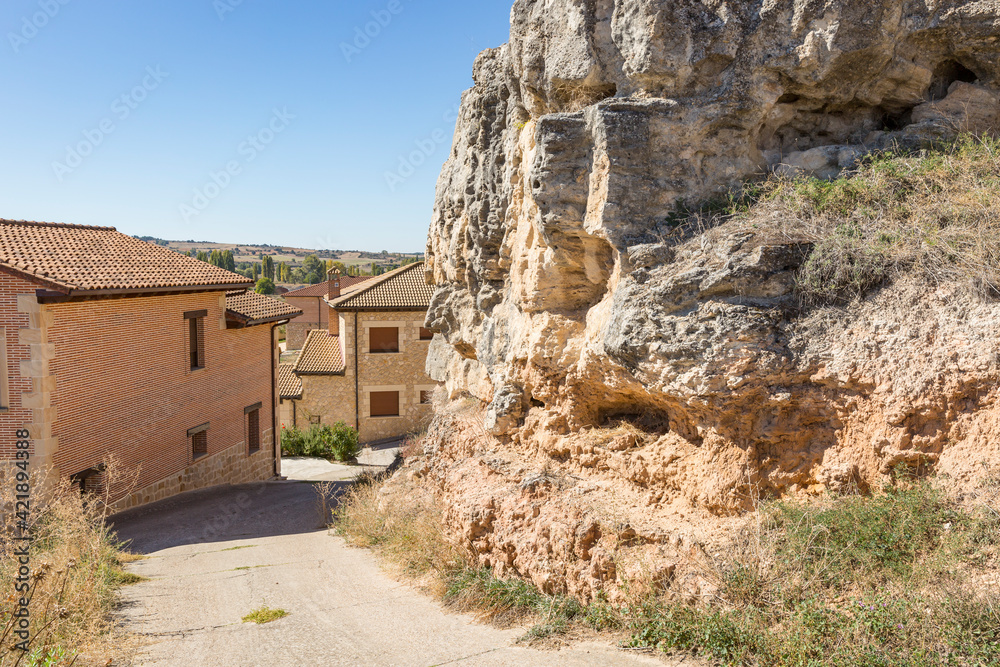 a street close to a rocky hill in Penaranda de Duero, province of Burgos, Castile and Leon, Spain
