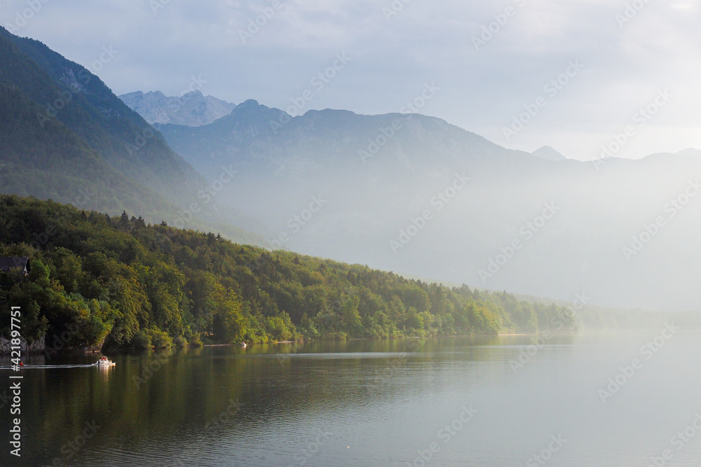 Morning fog on lake Bohinj, Slovenia. Defocused
