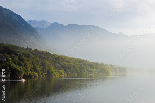 Morning fog on lake Bohinj  Slovenia. Defocused