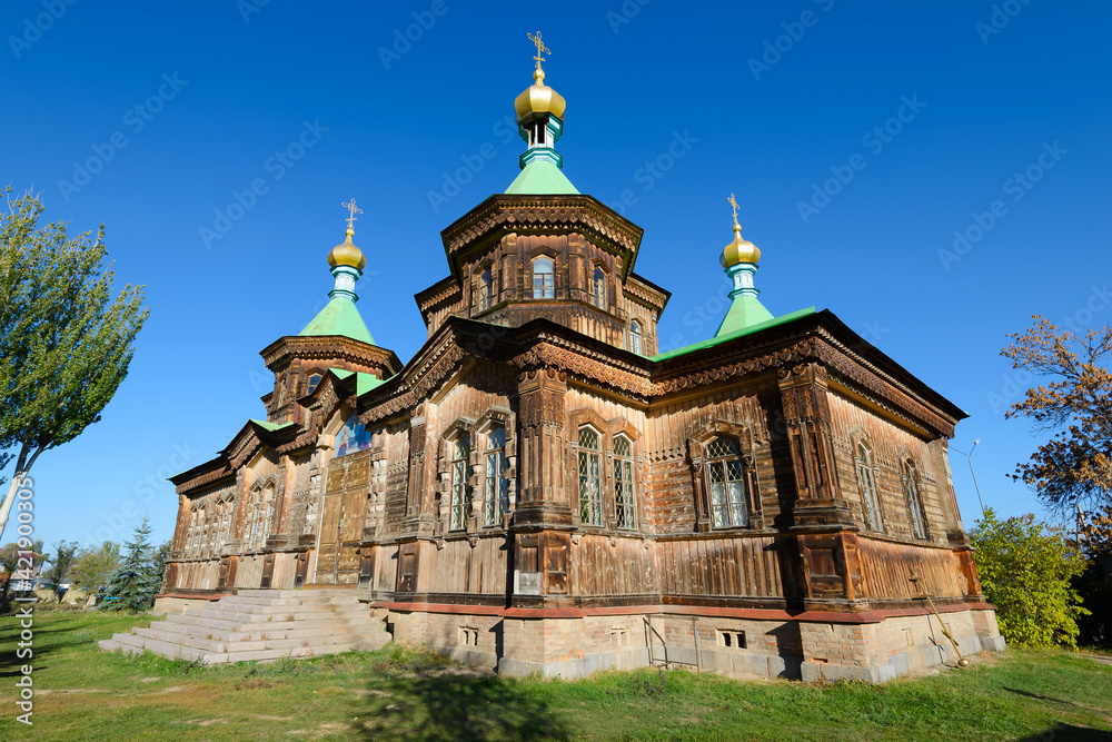Holy Trinity Orthodox Church in Karakol, Kyrgyzstan in Issyk-Kul Region. Wooden Cathedral with facade decorated with carvings.