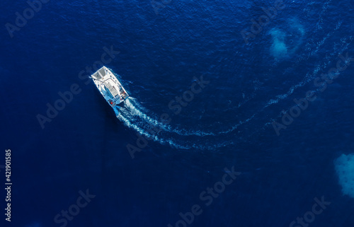 Croatia. Summer. Aerial view of floating yacht on blue Adriatic sea at sunny day.  Sail boat on sea surface. Seascape from drone. Travel and vacation image