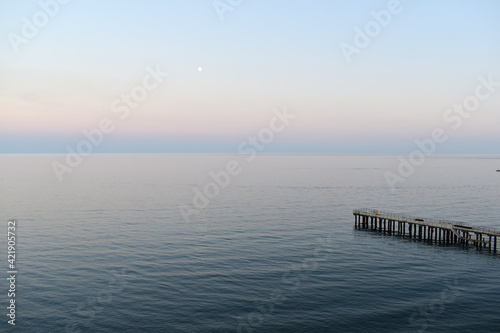 beautiful landscape with sea and pier in the evening