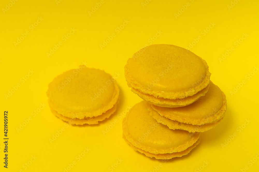 Yellow macaroons on yellow background