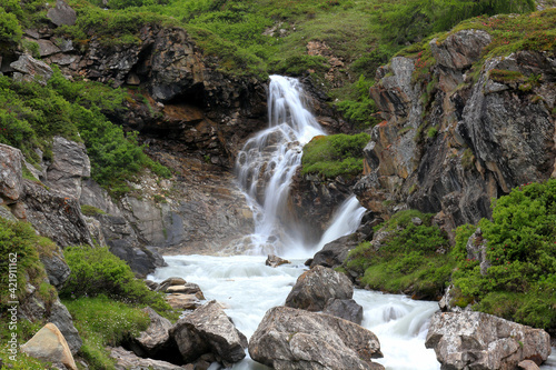 Waterfall in the Alps mountains 