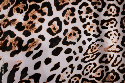 Leopard fur background. Leopard skin texture. Leopard print. Background with a pattern of leopard spots  safari background  banner design.